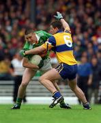 20 June 1999; Darragh Ó Sé of Kerry in action against Brendan Rouine of Clare during the Bank of Ireland Munster Senior Football Championship Semi-Final match between Kerry and Clare at Fitzgerald Stadium in Killarney, Kerry. Photo by Brendan Moran/Sportsfile