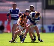 20 June 1999; Denis Byrne of Kilkenny is tackled by David Cuddy of Laois during the Guinness Leinster Senior Hurling Championship Semi-Final match between Kilkenny and Laois at Croke Park in Dublin. Photo by Ray McManus/Sportsfile