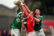 20 June 1999; Damien O'Neill of Cork in action against  Brian Begley, left, and Diarmuid Sheehy of Limerick during the Munster Senior Football Championship Semi-Final match between Cork and Limerick at Páirc Uí Rinn in Cork. Photo by Brendan Moran/Sportsfile