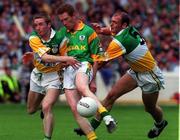 4 July 1999; Donal Curtis of Meath is tackled by David Connolly, left, and John Kenny of Offaly during the Leinster Senior Football Championship Semi-Final match between Meath and Offaly at Croke Park in Dublin. Photo by Matt Browne/Sportsfile