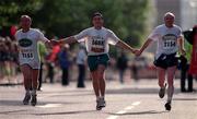 26 October 1998; Runners hold hands during the 98FM Dublin City Marathon in Dublin. Photo by Brendan Moran/Sportsfile