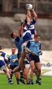 27 June 1999; Tony Maher of Laois, supported by team-mate George Doyle, wins a high ball against Enda Sheehy and Ciaran Whelhan of Dublin during the Leinster Senior Football Championship Semi-Final match between Dublin and Laois at Croke Park in Dublin. Photo by Brendan Moran/Sportsfile
