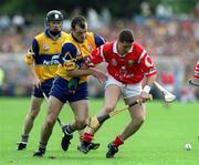 4 July 1999; Fergal McCormack of Cork in action against Ollie Baker of Clare during the Munster Senior Hurling Championship Final match between Cork and Clare at Semple Stadium in Thurles, Tipperary. Photo by Damien Eagers/Sportsfile