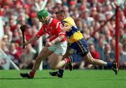 4 July 1999;  Fergal Ryan of Cork in action against Alan Markham of Clare during the Munster Senior Hurling Championship Final match between Cork and Clare at Semple Stadium in Thurles, Tipperary. Photo by Brendan Moran/Sportsfile