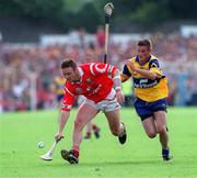 4 July 1999; Fergal Ryan of Cork in action against Alan Markham of Clare during the Munster Senior Hurling Championship Final match between Cork and Clare at Semple Stadium in Thurles, Tipperary. Photo by Damien Eagers/Sportsfile