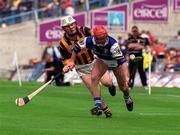 20 June 1999; Fionán O'Sullivan of Laois in action against Tom Hickey of Kilkenny during the Guinness Leinster Senior Hurling Championship Semi-Final match between Kilkenny and Laois at Croke Park in Dublin. Photo by Aoife Rice/Sportsfile