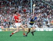 16 July 1990; Ger Fitzgerald of Cork in action against Conal Bonnar of Tipperary during the Munster Senior Hurling Championship Final match between Tipperary and Cork at Semple Stadium in Thurles, Tipperary. Photo by Ray McManus/Sportsfile