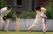 30 June 1999; Gordon Cooke of Ireland is bowled out by Jamie Sylvester of Wales as wicketkeeper Roger Clitheroe collects the ball during the Triple Crown Tournament match between Ireland and Wales at Leinster Cricket Club in Dublin. Photo by Brendan Moran/Sportsfile