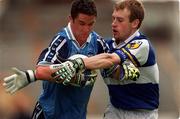27 June 1999; Ian Fitzgerald of Dublin is tackled by Thomas Lynch of Laois during the Leinster Senior Football Championship Semi-Final match between Dublin and Laois at Croke Park in Dublin. Photo by Brendan Moran/Sportsfile
