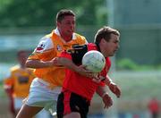 20 June 1999; James McCartan of Down in action against Geraoid Adams of Antrim during the Bank of Ireland Ulster Senior Football Championship Quarter-Final match between Down and Antrim at Pairc Esler in Newry, Down. Photo by David Maher/Sportsfile