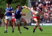 20 June 1999; Joe Brolly of Derry in action against Peter Reilly of Cavan during the Bank of Ireland Ulster Senior Football Championship Quarter-Final match between Cavan and Derry at Breffni Park in Cavan. Photo by Damien Eagers/Sportsfile
