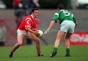 20 June 1999; Joe Kavanagh of Cork in action against Jason Stokes Limerick during the Munster Senior Football Championship Semi-Final match between Cork and Limerick at Páirc Uí Rinn in Cork. Photo by Brendan Moran/Sportsfile