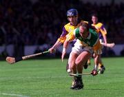 20 June 1999; John Troy of Offaly in action against Liam Dunne of Wexford during the Guinness Leinster Senior Hurling Championship Semi-Final match between Offaly and Wexford at Croke Park in Dublin. Photo by Aoife Rice/Sportsfile
