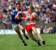 20 June 1999; Johnny McBride of Derry in action against Pat Sheils of Cavan during the Bank of Ireland Ulster Senior Football Championship Quarter-Final match between Cavan and Derry at Breffni Park in Cavan. Photo by Damien Eagers/Sportsfile