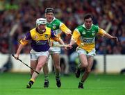 20 June 1999; Tom Dempsey of Wexford in action against Johnny Pilkington of Offaly during the Guinness Leinster Senior Hurling Championship Semi-Final match between Offaly and Wexford at Croke Park in Dublin. Photo by Ray McManus/Sportsfile