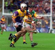 20 June 1999; Brian Whelahan of Offaly in action against Martin Storey of Wexford during the Guinness Leinster Senior Hurling Championship Semi-Final match between Offaly and Wexford at Croke Park in Dublin. Photo by Aoife Rice/Sportsfile