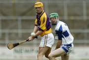 15 April 2006; Eoin Quigley, Wexford, in action against James Hyland, Laois. Allianz National Hurling League, Division 1, Relegation Semi-Final, Wexford v Laois, Nowlan Park, Kilkenny. Picture credit: Damien Eagers / SPORTSFILE