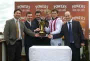 16 April 2006; A presentation is made to the winning connections, from left, Steve Lahiffe, Peter Gallogly, Commercial Director Irish Distillers Ltd, Anthony Killarney, Pierce Gatley, Jockey Tony McCoy and Trainer Eamon &quot;Dusty&quot; Sheehy, after Justified won the Powers Gold Cup. Fairyhouse Racecourse, Co. Meath. Picture credit: Ciara Lyster / SPORTSFILE