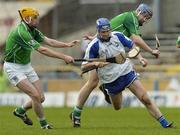16 April 2006; Michael Walsh, Waterford, in action against Paul O'Grady, left, and Stephen Lucey, Limerick. Allianz National Hurling League, Division 1 Quarter-Final, Waterford v Limerick, Semple Stadium, Thurles, Co. Tipperary. Picture credit: Brian Lawless / SPORTSFILE