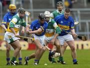 16 April 2006; Hugh Moloney, supported by team-mate John Carroll, right, Tipperary, in action against Dylan Hayden, left, and Kevin Brady, Offaly. Allianz National Hurling League, Division 1 Quarter-Final, Tipperary v Offaly, Semple Stadium, Thurles, Co. Tipperary. Picture credit: Brian Lawless / SPORTSFILE