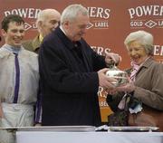 17 April 2006; An Taoiseach Berytie Ahern T.D. presents the Irish Grand National trophy to Phil Clune Hughes in the presence of jockey Philip Carberry, extreme left, and Paddy Clune Hughes, husband of owner Phil, after Point Barrow had won the Powers Whiskey Irish Grand National. Fairyhouse Racecourse, Co. Meath. Picture credit: Pat Murphy / SPORTSFILE