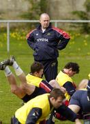 19 April 2006; Head Coach Declan Kidney watches his players stretch during Munster squad training. Thomond Park, Limerick. Picture credit; Pat Murphy / SPORTSFILE