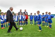24 May 2014; Stella Maris FC graduates John Giles with Cameron Hamilton from the under-10 Stella Maris FC team watches by his team-mates and FAI chief executive John Delaney with Colin Teahon from PST Sports were on hand to celebrate the opening of a state of the art pitch provided by PST Sport. PST Sport are leading artificial grass suppliers in Ireland since 2005. PST Sport provide low cost, high quality sports turf solutions and have installed over fifty pitches across Ireland for a range of GAA and soccer clubs as well as several schools. For further details see http://www.pst-sport.ie/ Stella Maris FC’s Clubhouse, Richmond Road, Drumcondra, Co. Dublin. Picture credit: Matt Browne / SPORTSFILE