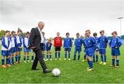 24 May 2014; Stella Maris FC graduates John Giles with Cameron Hamilton from the under-10 Stella Maris FC team watched by his team-mates to celebrate the opening of a state of the art pitch provided by PST Sport. PST Sport are leading artificial grass suppliers in Ireland since 2005. PST Sport provide low cost, high quality sports turf solutions and have installed over fifty pitches across Ireland for a range of GAA and soccer clubs as well as several schools. For further details see http://www.pst-sport.ie/ Stella Maris FC’s Clubhouse, Richmond Road, Drumcondra, Co. Dublin. Picture credit: Matt Browne / SPORTSFILE