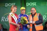 24 May 2014; Mark Dowling, Dunboyne D.I.D, Meath, is presented with the Crystal county rider by Miss An Post Rás Baltinglass Amy Faulkner and An Post Rás Route Director Tony Campbell after Stage 7 of the 2014 An Post Rás. Carrick on Suir - Baltinglass. Picture credit: Ramsey Cardy / SPORTSFILE