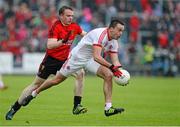 24 May 2014; Kyle Coney, Tyrone, in action against Brendan McArdle, Down. Ulster GAA Football Senior Championship, Preliminary Round Replay, Down v Tyrone, Pairc Esler, Newry, Co. Down. Picture credit: Oliver McVeigh / SPORTSFILE