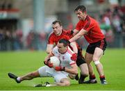24 May 2014; Kyle Coney, Tyrone, in action against Brendan McArdle and Mark Poland,Down. Ulster GAA Football Senior Championship, Preliminary Round Replay, Down v Tyrone, Pairc Esler, Newry, Co. Down. Picture credit: Oliver McVeigh / SPORTSFILE