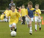 18 April 2006; Jason Kirwan, aged 8, from Merchant Road, Dulin, left, in action against Aaron Montgomery, aged 8, from Ringsend, during the 4th Annual Docklands Festival of Football. Tolka Rovers FC, Frank Cooke Park, Griffith Avenue, Dublin. Picture credit: Pat Murphy / SPORTSFILE