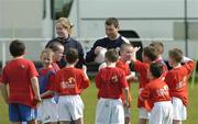 18 April 2006; Former Republic of Ireland star Denis Irwin speaks to his players during the 4th Annual Docklands Festival of Football. Tolka Rovers FC, Frank Cooke Park, Griffith Avenue, Dublin. Picture credit: Pat Murphy / SPORTSFILE
