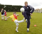 18 April 2006; Republic of Ireland manager Steve Staunton is tackled by 7 year old Dion Piggott during the 4th Annual Docklands Festival of Football. Tolka Rovers FC, Frank Cooke Park, Griffith Avenue, Dublin. Picture credit: Pat Murphy / SPORTSFILE