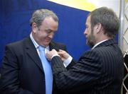 22 April 2006; The outgoing GAA President Sean Kelly pins the presidental badge on to the lapel of the incoming President Nickey Brennan at the 2006 GAA Annual Congress. Great Southern Hotel, Killarney, Co. Kerry. Picture credit: Ray McManus / SPORTSFILE