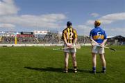 23 April 2006; Kilkenny's Eoin Larkin, 12, and Tipperary's Eamonn Corcoran stand for Amhran na bhFiann in front of supporters at the Killinan end. Allianz National Hurling League, Division 1 Semi-Final, Kilkenny v Tipperary, Semple Stadium, Thurles, Co. Tipperary. Picture credit: Ray McManus / SPORTSFILE