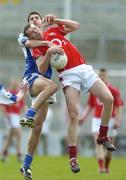 23 April 2006; Brendan Quigley, Laois, in action against Alan O'Connor, Cork. Cadbury's All-Ireland U21 Football Championship Semi-Final, Cork v Laois, Gaelic Grounds, Limerick. Picture credit: Damien Eagers / SPORTSFILE