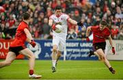 24 May 2014; Sean Cavanagh, Tyrone,with a shot at goal dispite the attentions of Ryan Boyle and Mark Poland,Down. Ulster GAA Football Senior Championship, Preliminary Round Replay, Down v Tyrone, Pairc Esler, Newry, Co. Down. Picture credit: Oliver McVeigh / SPORTSFILE