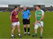 24 May 2014; Referee Eamonn Hassan performs the pre-match coin toss with Westmeath captain Eoin Price, left, and London captain Henry Vaughan. GAA Leinster Senior Hurling Championship Qualifier Group, Round 5, Westmeath v London, Cusack Park, Mullingar, Co. Westmeath. Picture credit: Piaras Ó Mídheach / SPORTSFILE