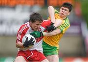 25 May 2014; Barry Grant, Derry, in action against Colm Kelly, Donegal.  Electric Ireland Ulster GAA Football Minor Championship Quarter Final, Derry v Donegal, Celtic Park, Derry. Picture credit: Pat Murphy / SPORTSFILE