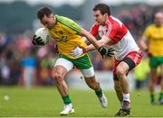 25 May 2014; Karl Lacey, Donegal, in action against Benny Heron, Derry. Ulster GAA Football Senior Championship Quarter-Final, Derry v Donegal, Celtic Park, Derry. Picture credit: Pat Murphy / SPORTSFILE