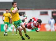 25 May 2014; Martin McElhinney, Donegal, in action against Emmet Bradley, Derry. Ulster GAA Football Senior Championship Quarter-Final, Derry v Donegal, Celtic Park, Derry. Picture credit: Pat Murphy / SPORTSFILE