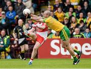 25 May 2014; Ryan Bell, Derry, has a shot blocked by Neil Gallagher, Donegal. Ulster GAA Football Senior Championship Quarter-Final, Derry v Donegal, Celtic Park, Derry. Picture credit: Oliver McVeigh / SPORTSFILE