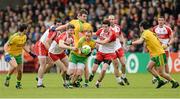25 May 2014; Anthony Thompson, Donegal, in action against Niall Holly and Emmet Bradley, Derry. Ulster GAA Football Senior Championship Quarter-Final, Derry v Donegal, Celtic Park, Derry. Picture credit: Oliver McVeigh / SPORTSFILE