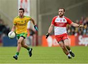 25 May 2014; Odhran MacNiallais, Donegal, in action against Emmett McGuckin, Derry. Ulster GAA Football Senior Championship Quarter-Final, Derry v Donegal, Celtic Park, Derry. Picture credit: Oliver McVeigh / SPORTSFILE
