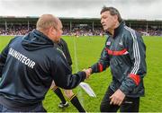 25 May 2014; Waterford manager Derek McGrath, left, and Cork manager Jimmy Barry Murphy exchange a handshake after the game ended in a draw. Munster GAA Hurling Senior Championship, Quarter-Final, Cork v Waterford, Semple Stadium, Thurles, Co. Tipperary. Picture credit: Diarmuid Greene / SPORTSFILE