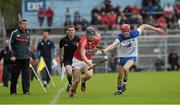 25 May 2014; Conor Lehane, Cork, in action against Tadhg Burke, Waterford, under the watchful eyers of linesman James Owens and Jimmy Barry Murphy. Munster GAA Hurling Senior Championship, Quarter-Final, Cork v Waterford, Semple Stadium, Thurles, Co. Tipperary. Picture credit: Ray McManus / SPORTSFILE