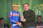 25 May 2014; Mark Dowling, Dunboyne D.I.D, Meath, is presented with the Crystal county rider by An Post Rás Route Director Tony Campbell after Stage 8 of the 2014 An Post Rás. Newbridge - Skerries. Picture credit: Ramsey Cardy / SPORTSFILE