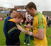 25 May 2014; Donegal's Eamon McGee signs autographs for fans after the game. Ulster GAA Football Senior Championship Quarter-Final, Derry v Donegal, Celtic Park, Derry. Picture credit: Oliver McVeigh / SPORTSFILE