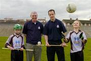20 April 2006; Antrim hurler Ciaran Herron with county Co-ordinator Liam McGoldrick, Eoin Fox, left, and Paula Rice at the launch of the Ulster Vhi Cúl Camps. Inter county stars from all over Ulster were present to announce details of the popular Summer Camps which start on July 3rd. The Vhi Cúl Camps are a nationally co-ordinated programme that aims to encourage children to learn and develop sporting and life-skills by particpating in Gaelic Games, in a fun, non-competitive environment. Gaelic Grounds, Armagh. Picture credit: Damien Eagers / SPORTSFILE